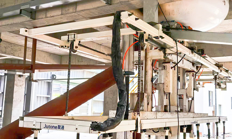 Levantamiento del dispositivo del brazo de vertido